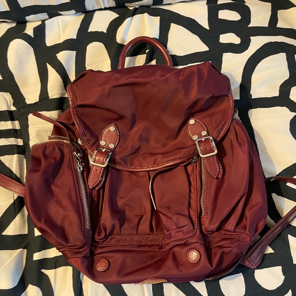 Mz Wallace burgundy backpack with a dust bag
